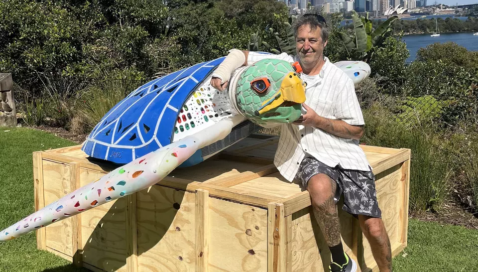 Artist David Day and turtle sculpture