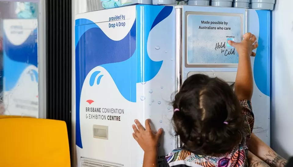 Child using AquaUbique water cooler