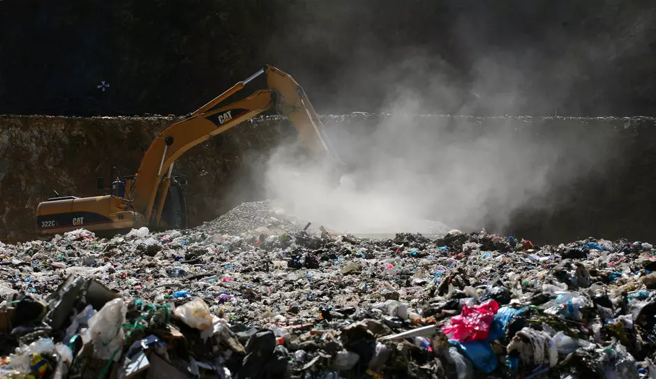 Bulldozer sorting waste